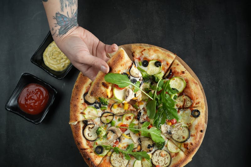 Mod Pizza founder crafting fresh mod pizza in our kitchen